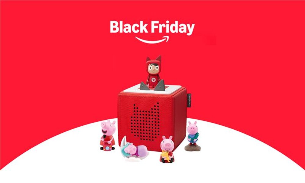 Der Schriftzug "Black Friday 2024" mit dem Amazon-Logo, darunter die Toniebox in Rot mit verschiedenen bunten Figuren.   | © Amazon