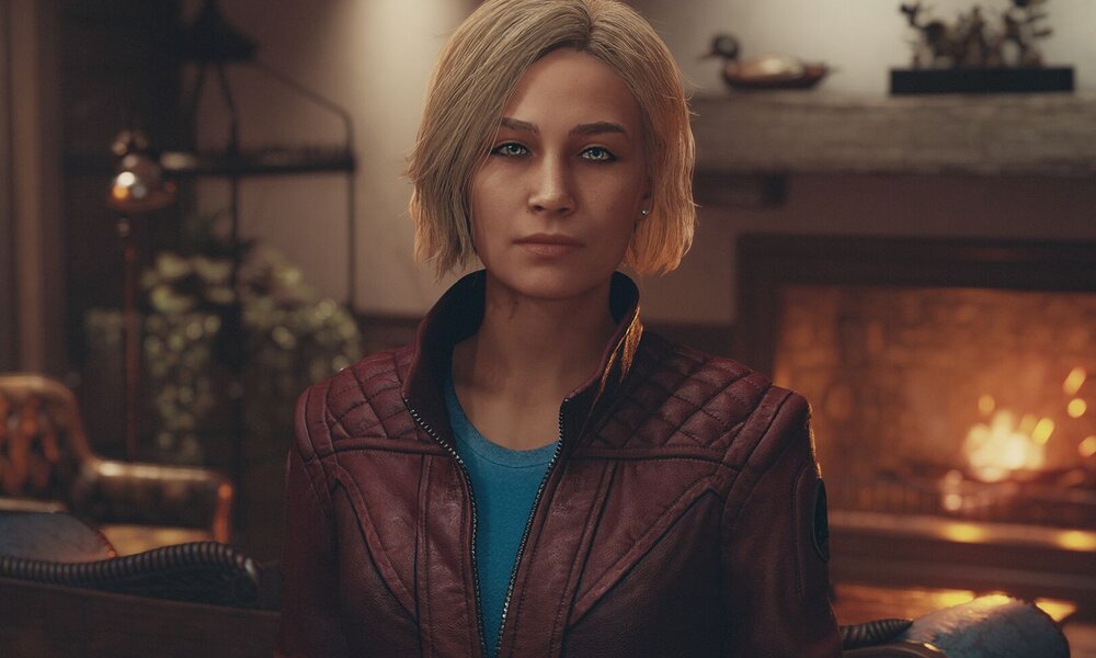 Eine blonde Frau in einer weinroten Jacke steht vor einem Kamin und wirft dir einen erwartungsvollen Blick zu. | © Bethesda
